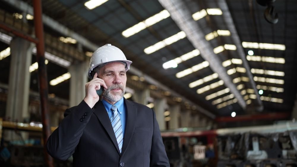 Manager explaining insurance on a phone call