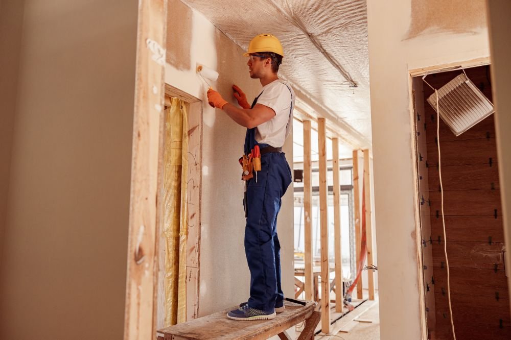 painter on construction site with a public liability policy
