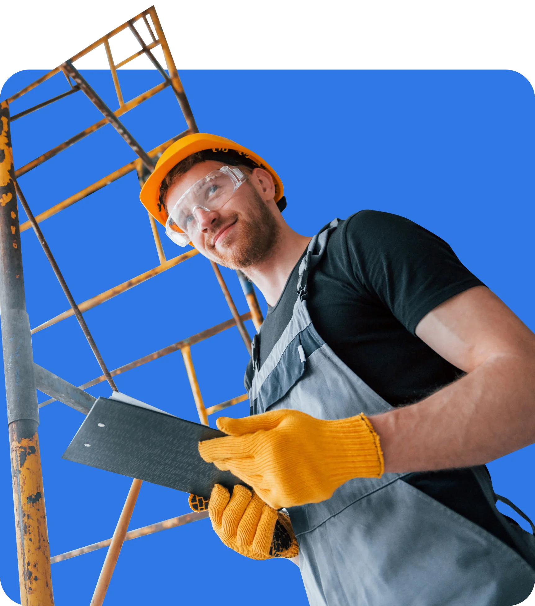 A construction worker wears a yellow helmet, safety glasses, and gloves while holding a clipboard. Scaffolding insurance ensures his safety, visible in the background against a blue backdrop.