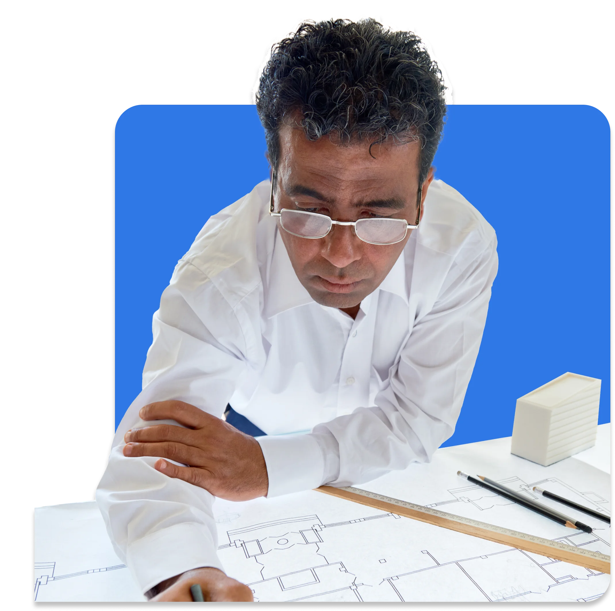 A man in a white shirt and glasses is intently examining architectural blueprints on a table with a ruler, pen, and a small model building, ensuring every detail meets engineering standards for insurance purposes.